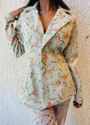 Front detail of the floral trouser suit