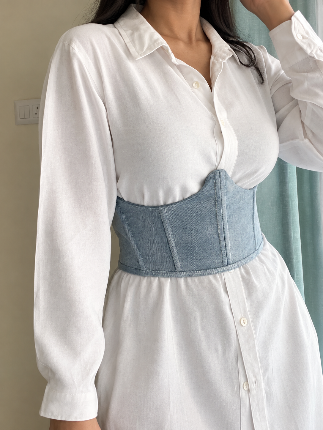 Blue corset over white shirt student project